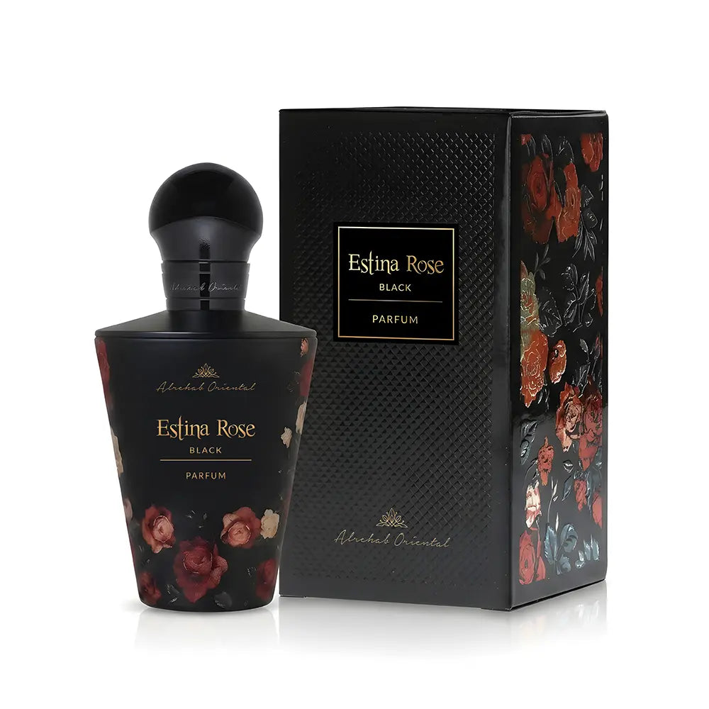 A bottle of Alhambra Oriental Estina Rose Black Parfum next to its textured black packaging box, both decorated with red and pink rose illustrations on a white background.