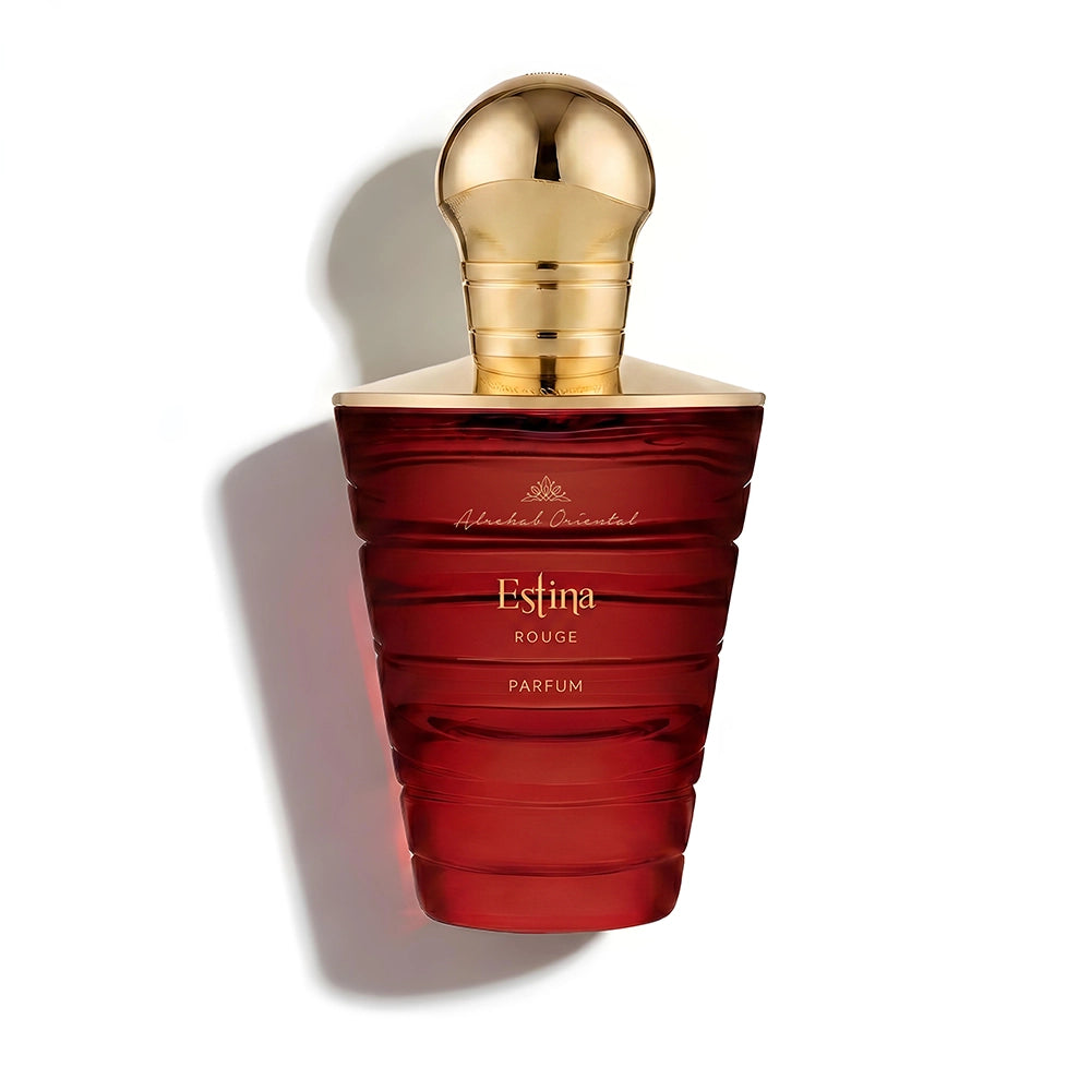 A bottle of Estina Rouge Parfum by Edinburgh Oriental, featuring a deep red ribbed glass bottle and a metallic gold spherical cap, set against a plain white background with a soft shadow.