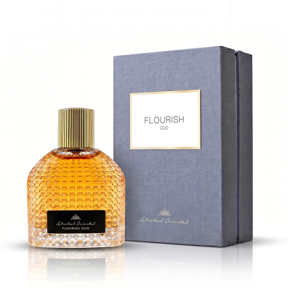 Flourish Oud perfume bottle with textured amber liquid and a gold cap, shown next to its dark gray box on a white background.