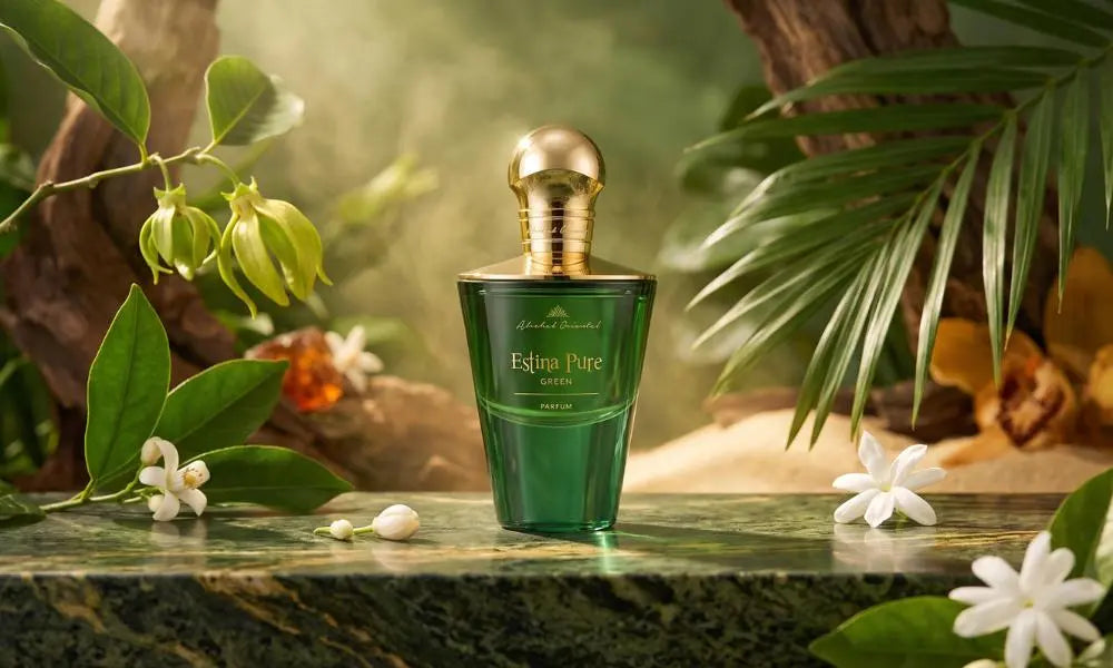 Flat lay of Estina Pure perfume surrounded by colorful flowers, vanilla beans, and natural resins. 