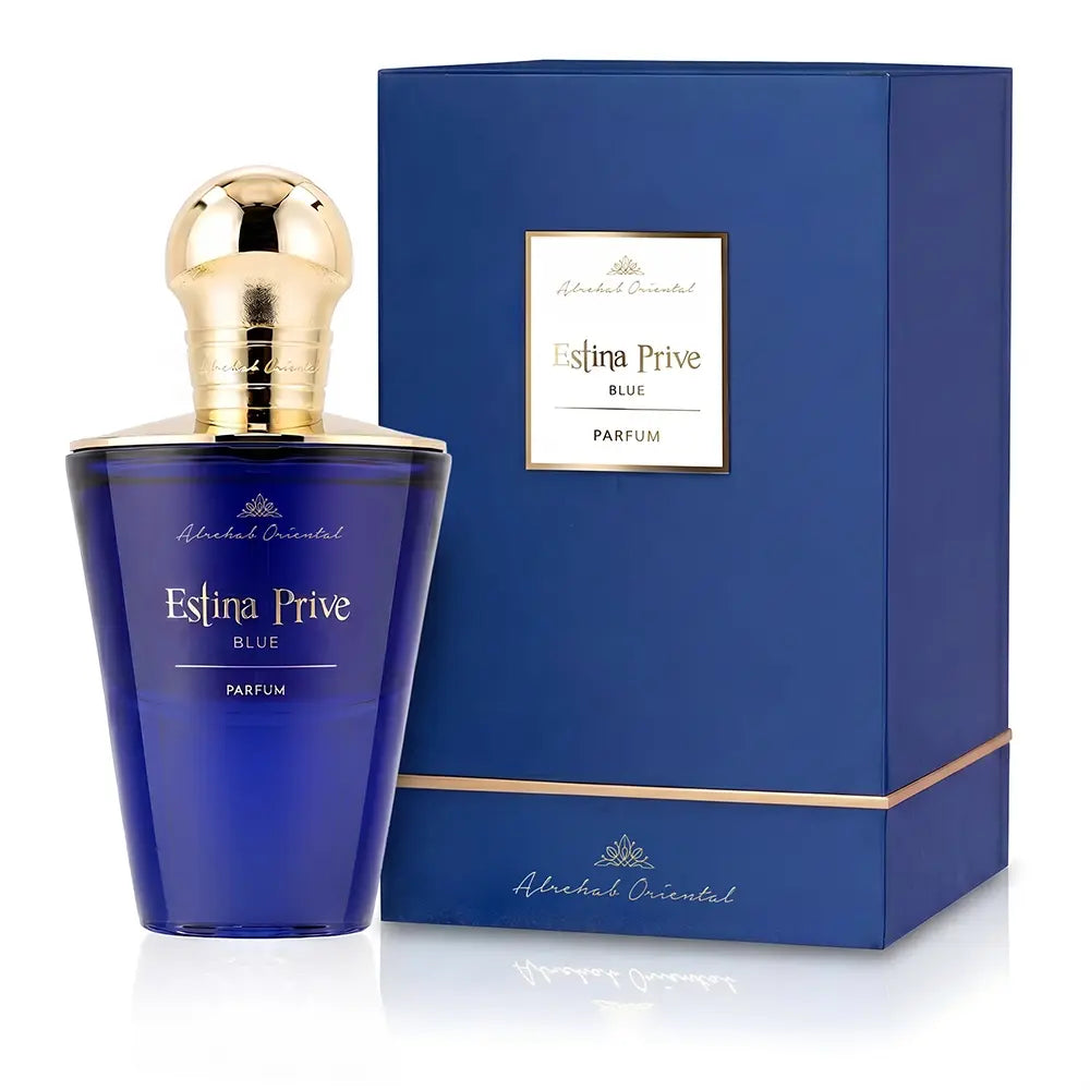 Alreded Oriental Estina Prive Blue Parfum bottle in a deep blue glass with a metallic gold cap, shown next to its matching blue packaging box with gold trim.