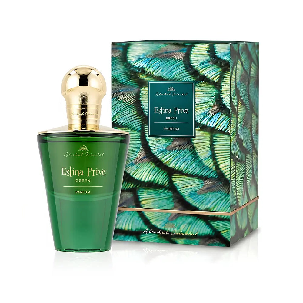 A green glass perfume bottle with a gold cap stands in front of its matching box, which features a green and teal feather pattern. The bottle and box are labeled 'Estina Prive Green' and 'Parfums de Marly'.