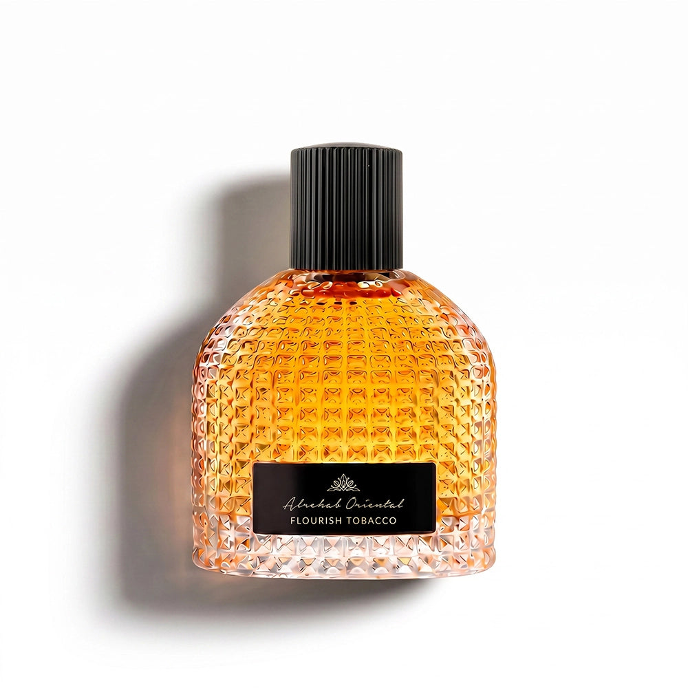 A textured glass bottle of Flavourish Tobacco by Flavour & Orient, filled with amber-colored liquid, featuring a black ribbed cap and a black label with white text, set against a plain white background with a soft shadow.
